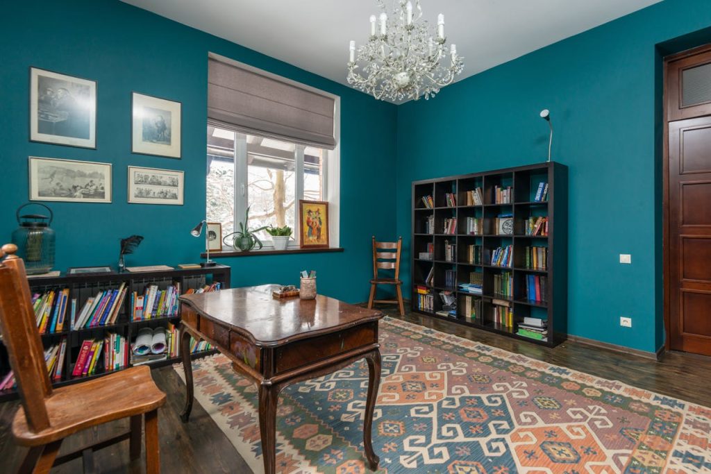 Interior of room with bookshelves and table